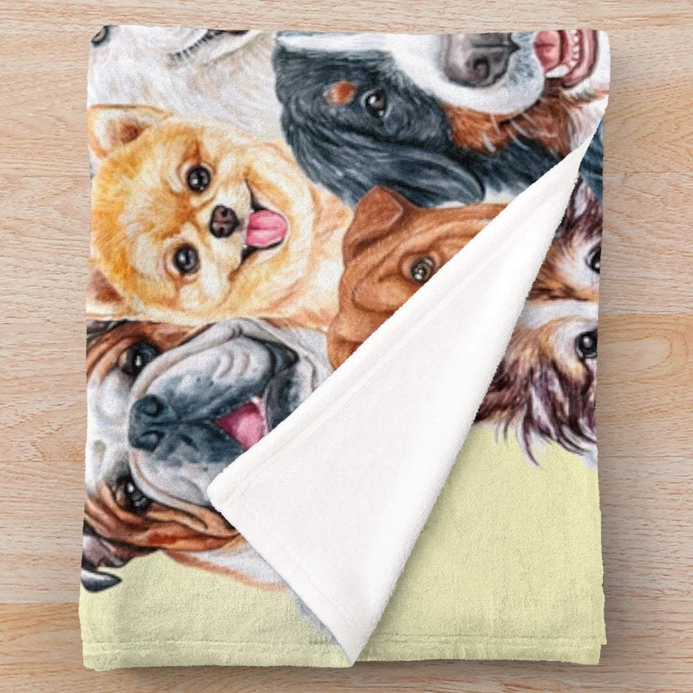 Colorful collage of painted dog faces on a plush blanket