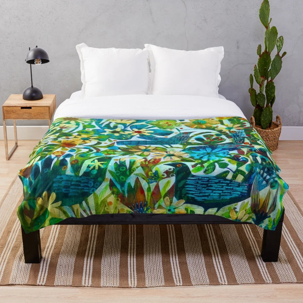 Colorful floral plush blanket with birds and flowers designed by Este MacLeod