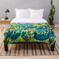 Colorful floral plush blanket with birds and flowers designed by Este MacLeod