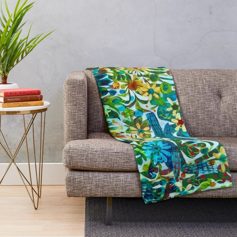 Colorful floral plush blanket with birds and flowers designed by Este MacLeod