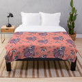Colorful plush blanket featuring an Alice in Wonderland inspired design with a cat and flowers