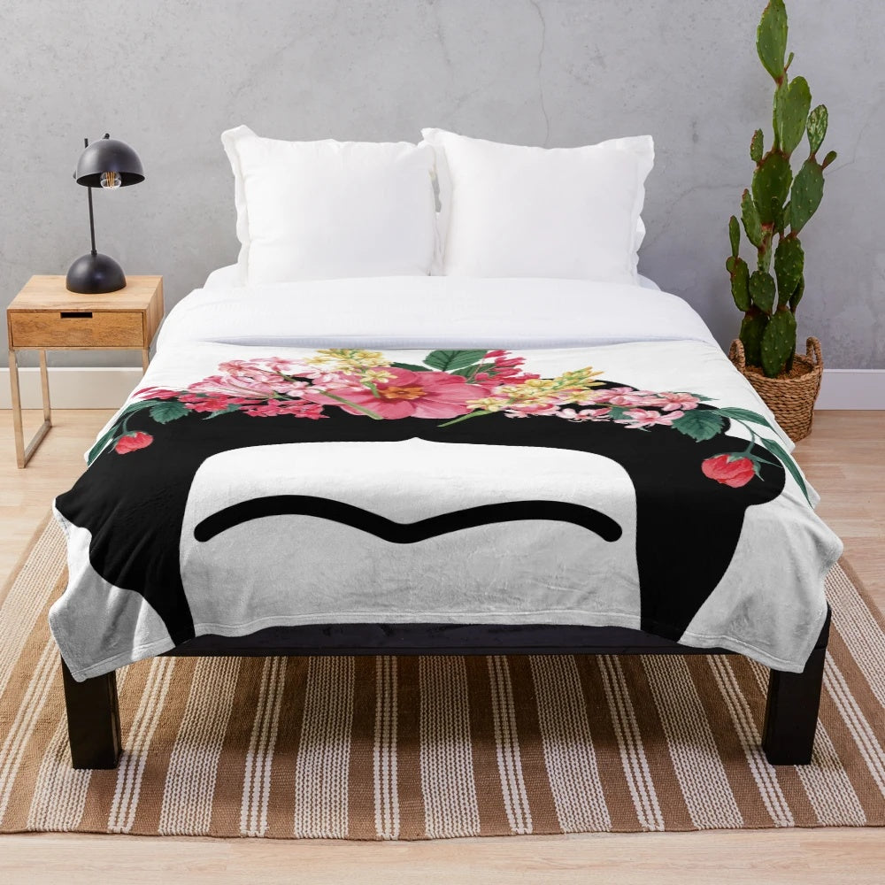 Vibrant plush blanket featuring the iconic portrait of Mexican artist Frida Kahlo