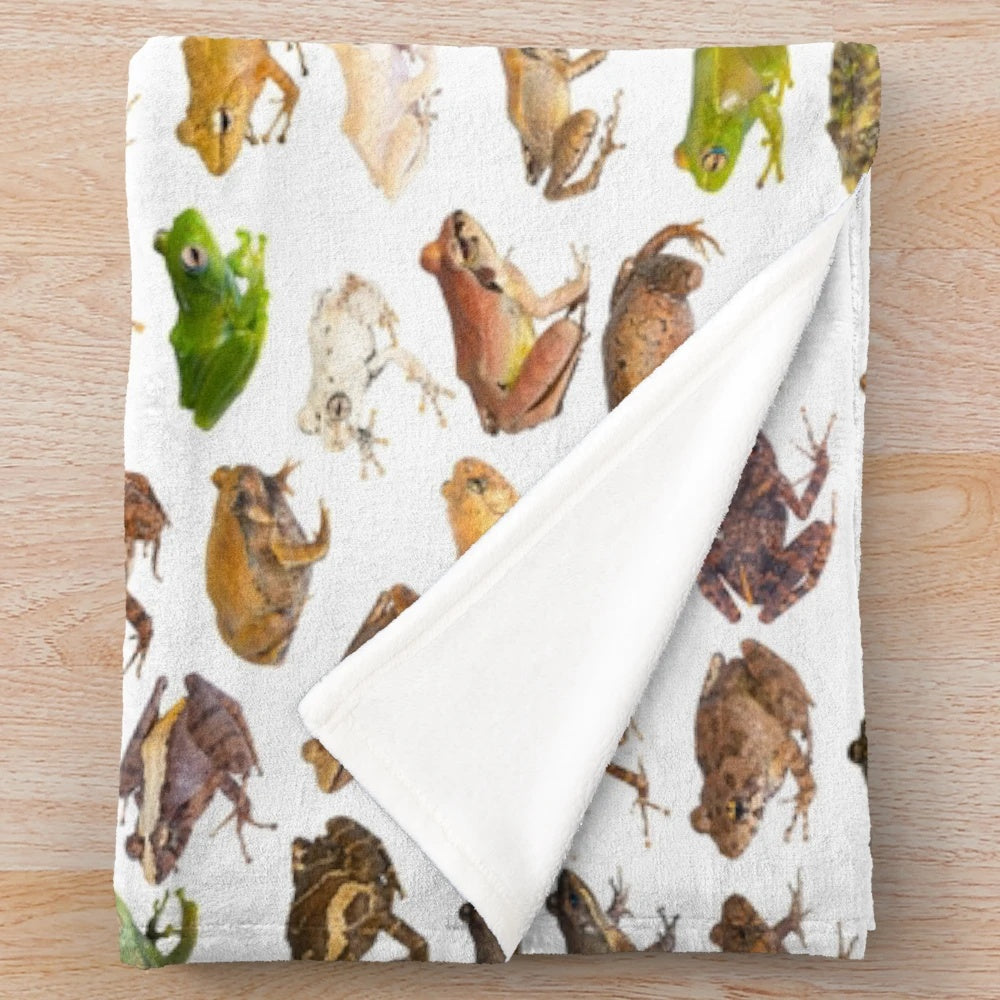 Plush blanket featuring a colorful illustration of 101 frog species found in Madagascar