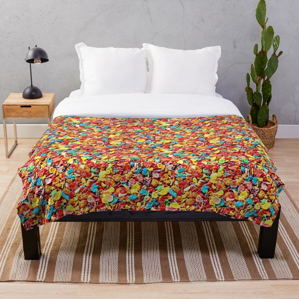 Fruity cereal themed plush blanket with colorful loops, circles, and hoops