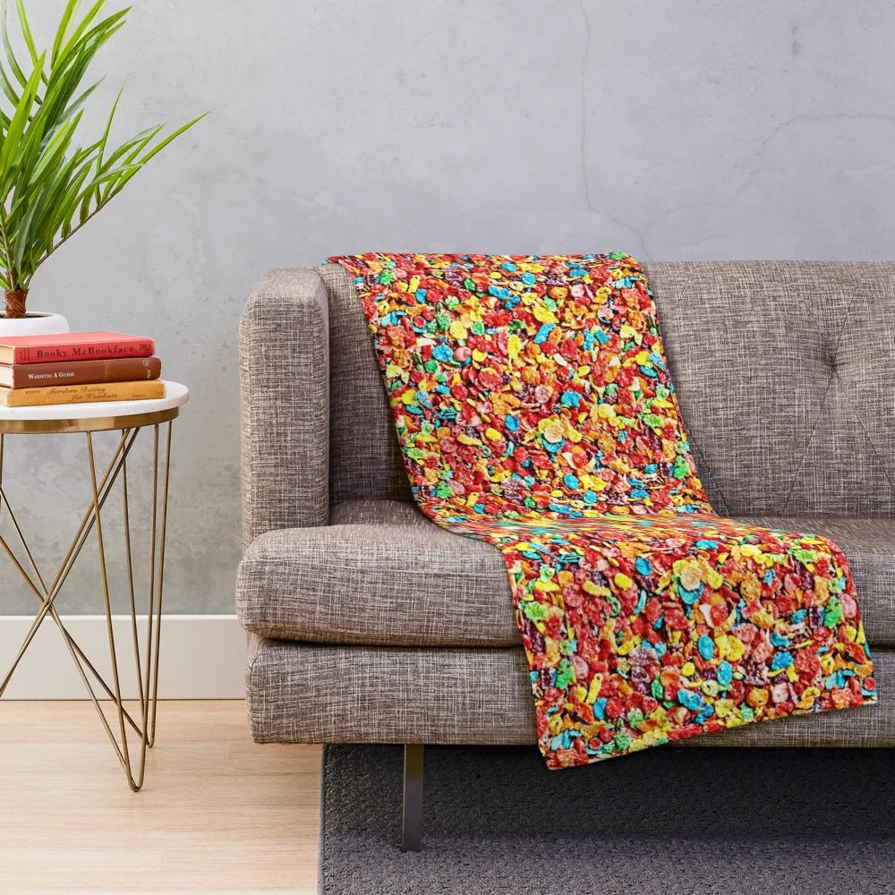 Fruity cereal themed plush blanket with colorful loops, circles, and hoops