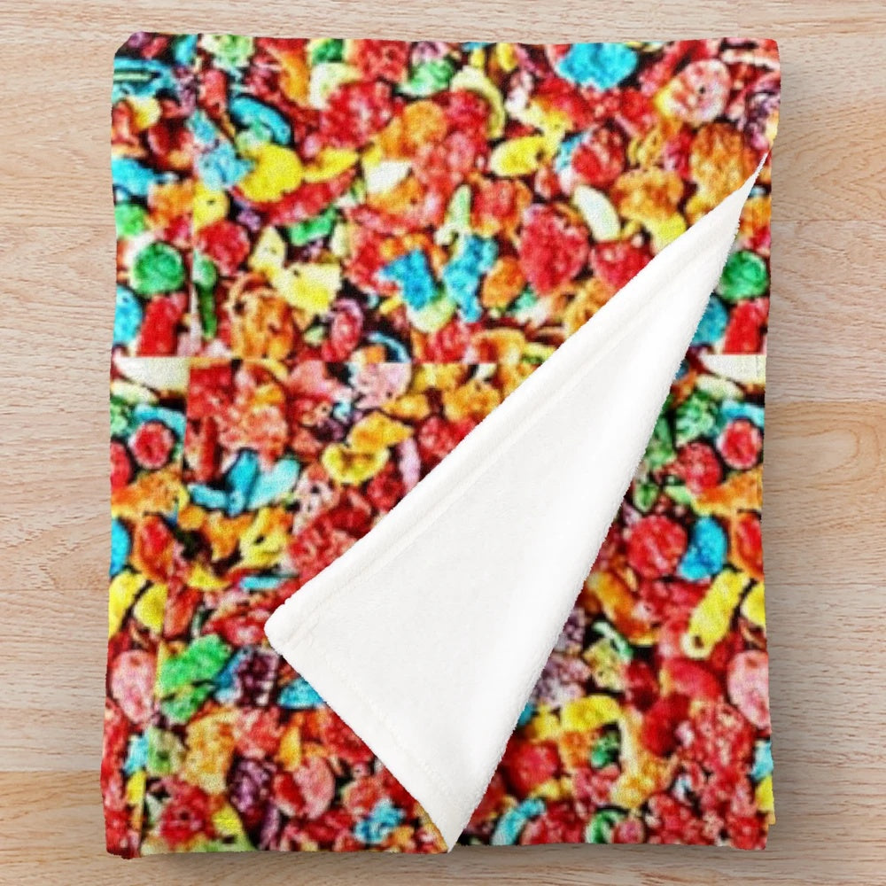 Fruity cereal themed plush blanket with colorful loops, circles, and hoops