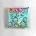 Vibrant, multicolored pillow featuring a garden of flowers, vegetables, and a rainbow design.