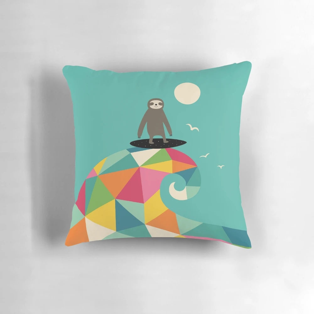 A vibrant, geometric-patterned pillow depicting a sloth surfing a wave