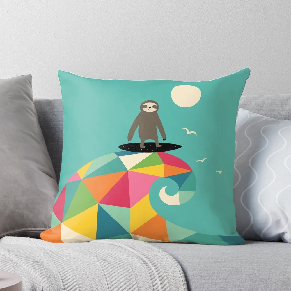 A vibrant, geometric-patterned pillow depicting a sloth surfing a wave