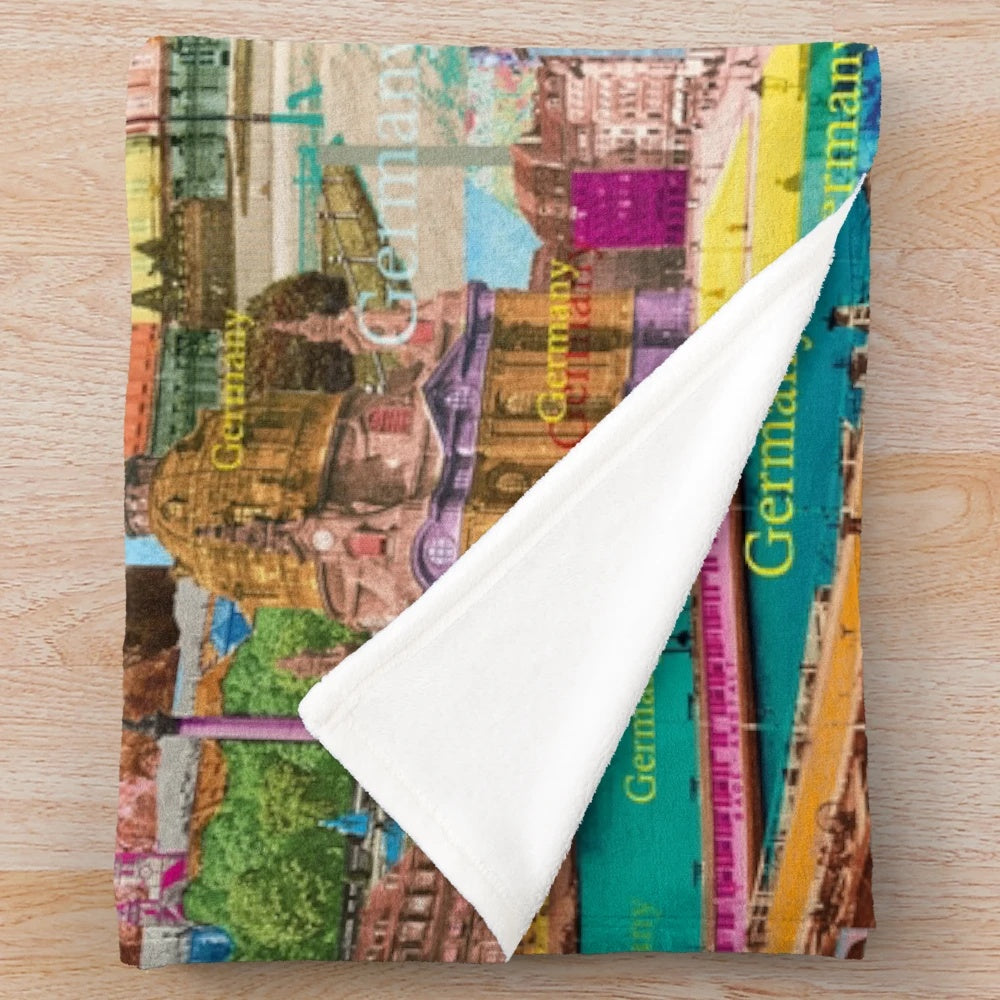 Colorful plush blanket featuring a digital collage of Germany's architecture and sights