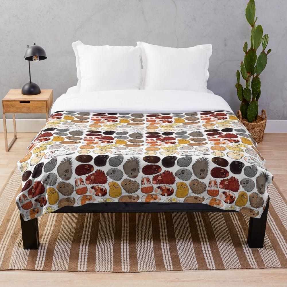 Colorful gradient-patterned plush blanket featuring cute guinea pigs
