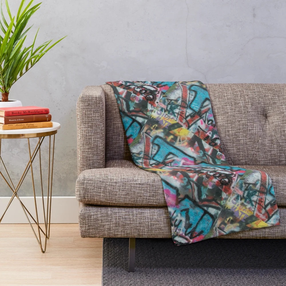 Graffiti pattern plush blanket with abstract, vibrant colors and urban style