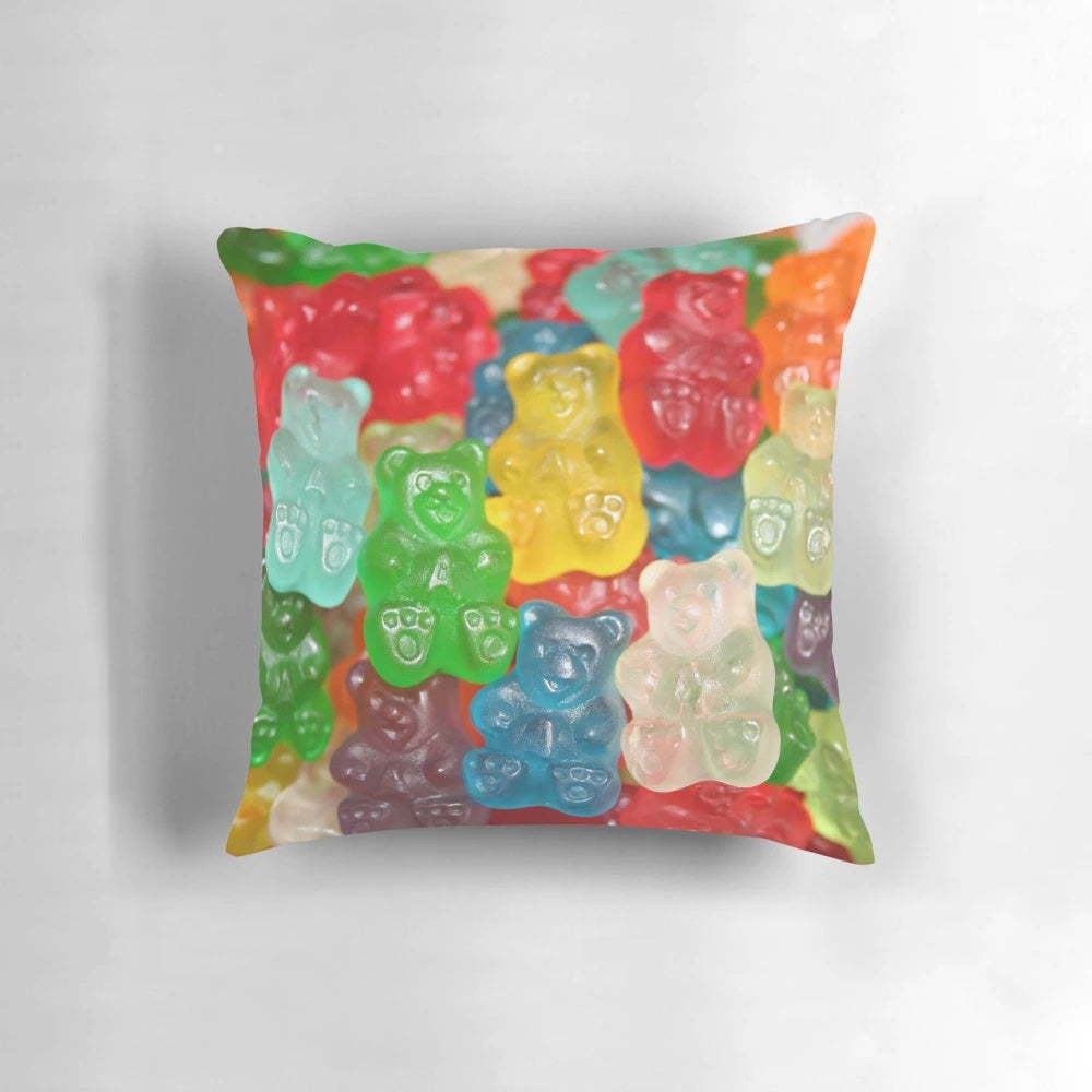 Vibrant gummy bear-shaped pillow in a rainbow of colors