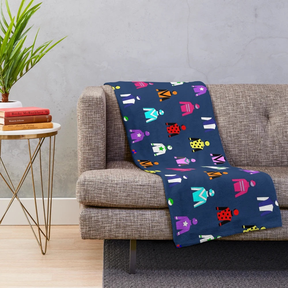 Colorful horse racing jockey silks pattern on navy blue plush blanket