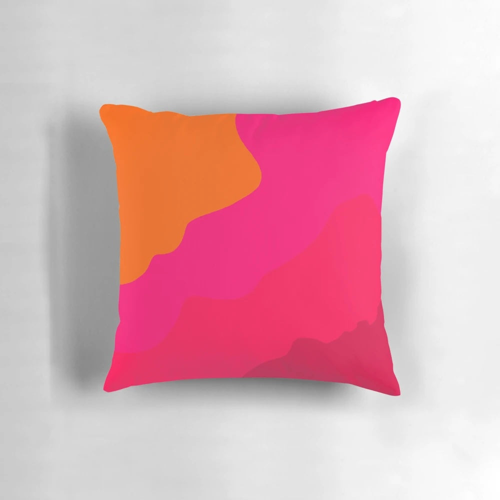 A vibrant hot pink to orange gradient throw pillow with a modern, minimalist design.