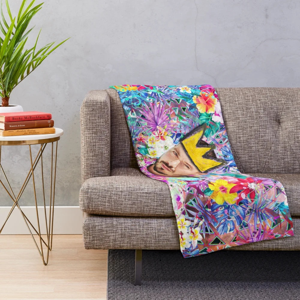 Vibrant portrait of Colombian reggaeton artist J Balvin printed on a plush blanket