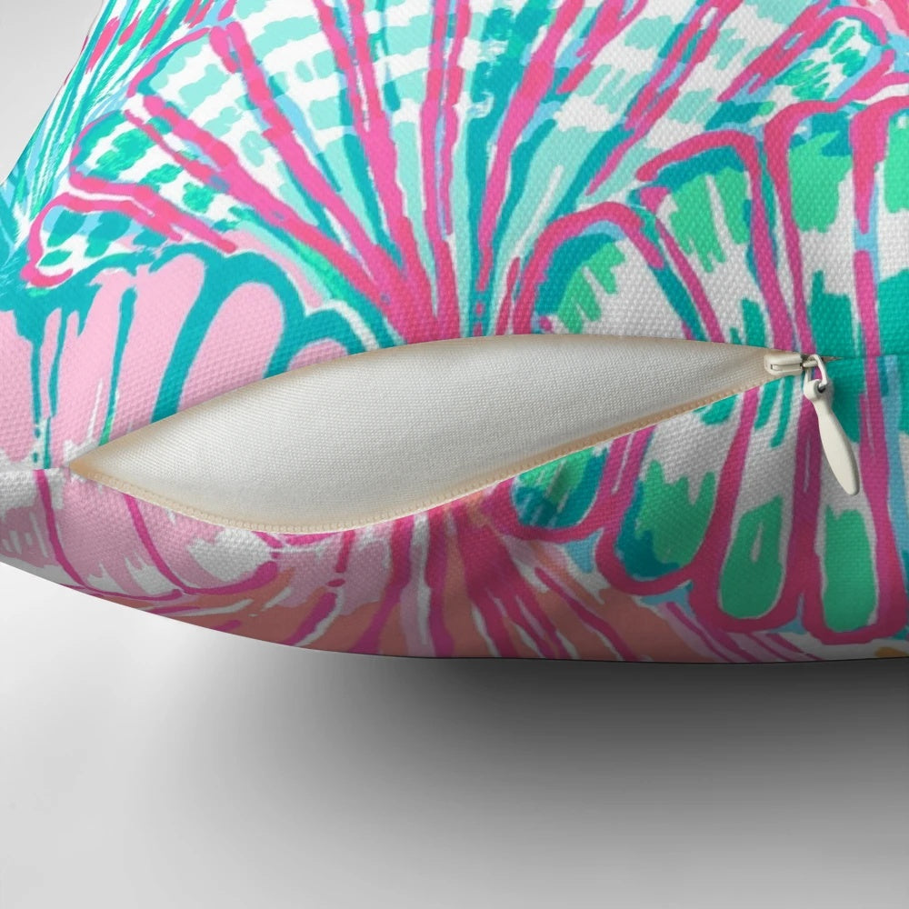 Vibrant and colorful shell-patterned pillow inspired by the iconic Lilly Pulitzer designs