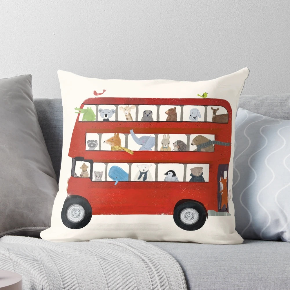 Vibrant illustration of a red London bus on a soft, decorative pillow for a nursery or child's room.