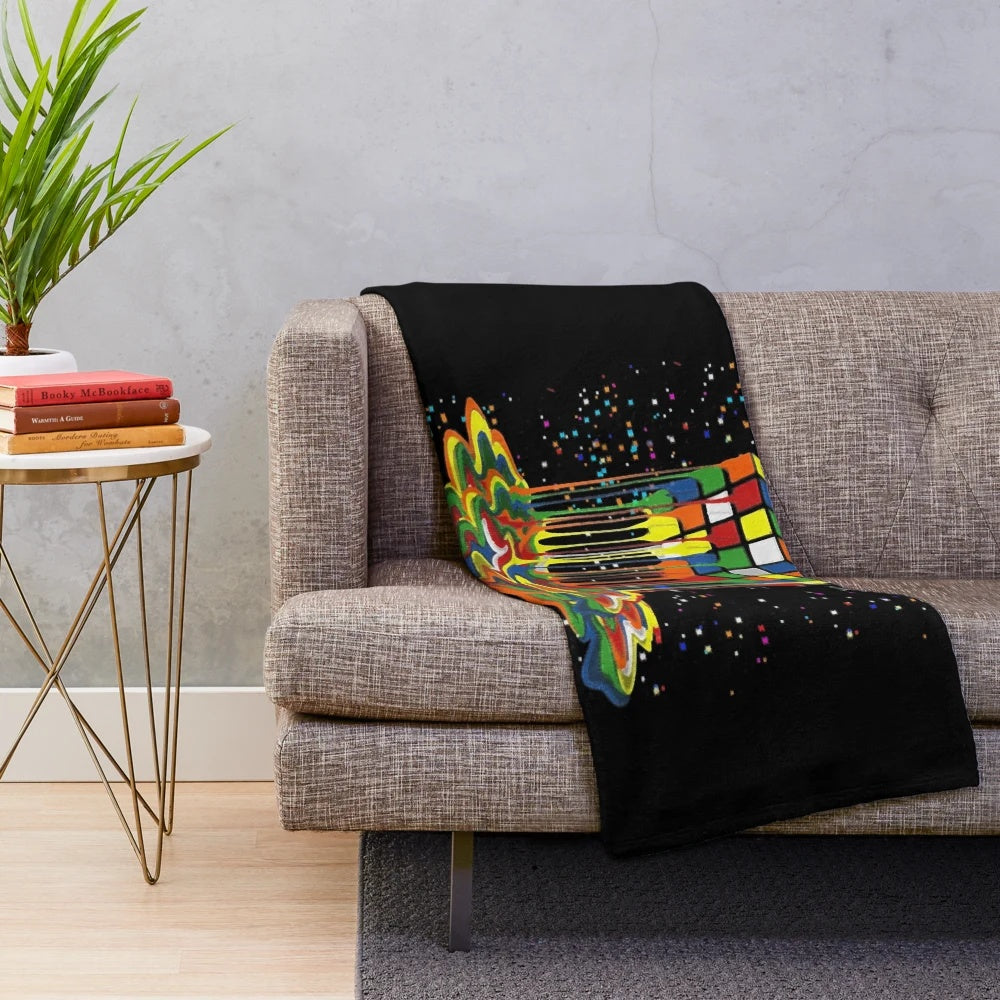 Colorful melting Rubik's cube graphic on a plush blanket