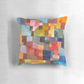 Colorful decorative pillow featuring abstract architectural design in the style of artist Paul Klee