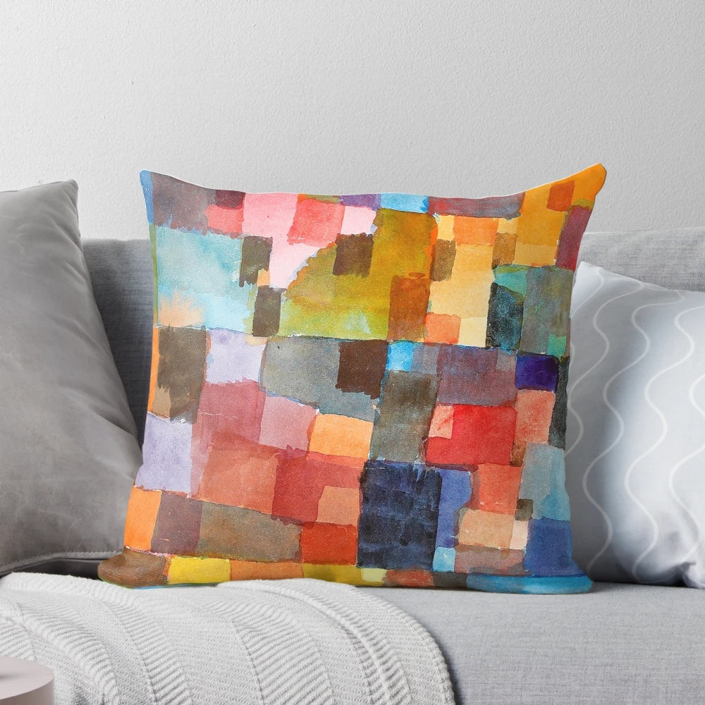 Colorful decorative pillow featuring abstract architectural design in the style of artist Paul Klee