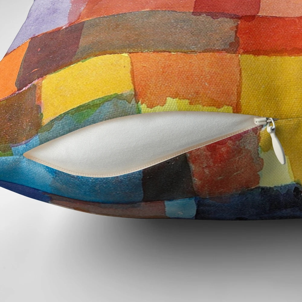 Colorful decorative pillow featuring abstract architectural design in the style of artist Paul Klee