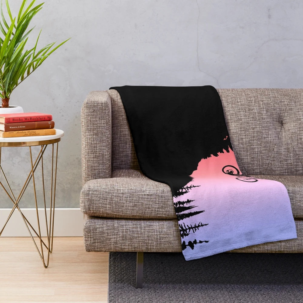 Colorful plush blanket featuring mountain bike-inspired design
