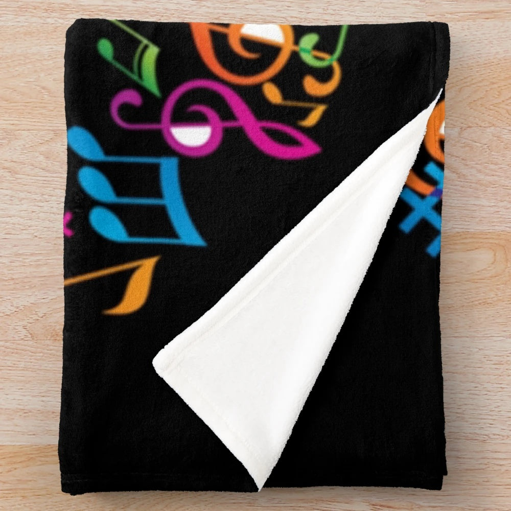 Colorful musical note plush blanket with different instruments and sound waves