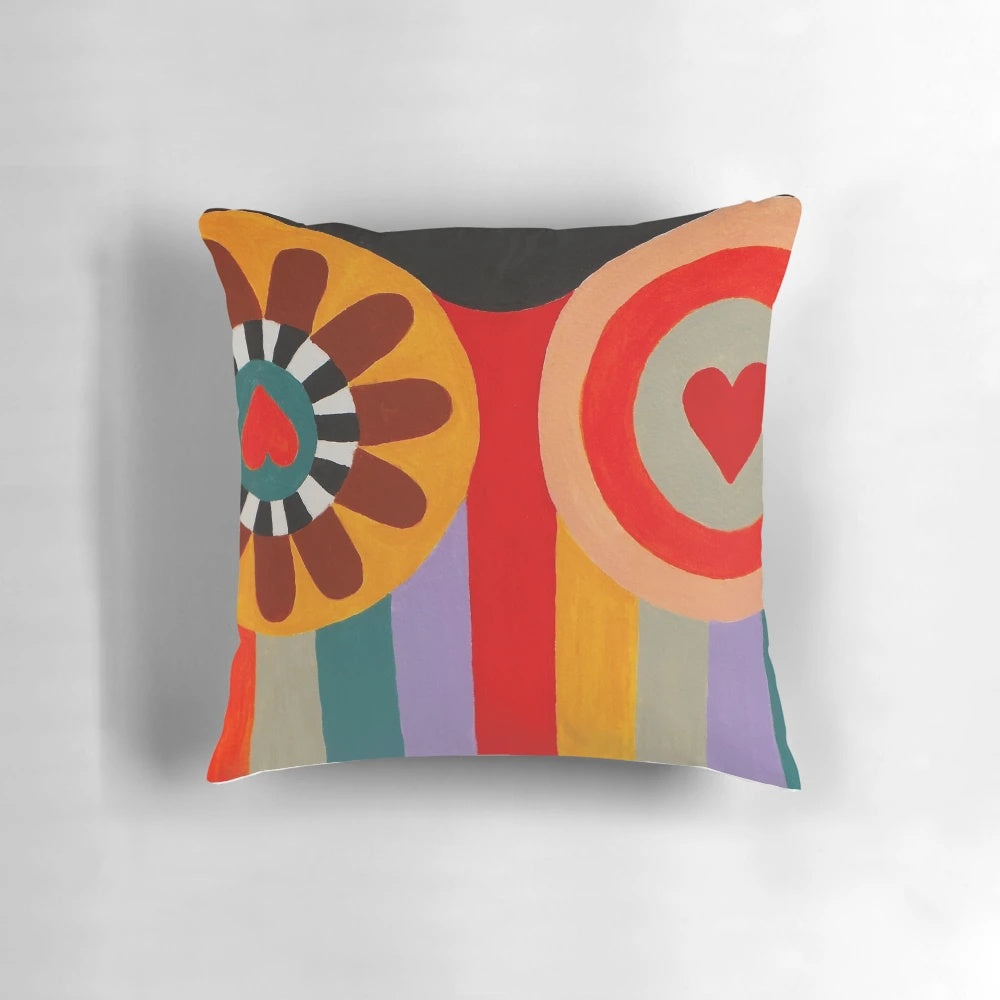 Vibrant Nana painting pillow in homage to French artist Niki de Saint Phalle, featuring colorful stripes and a playful female figure.