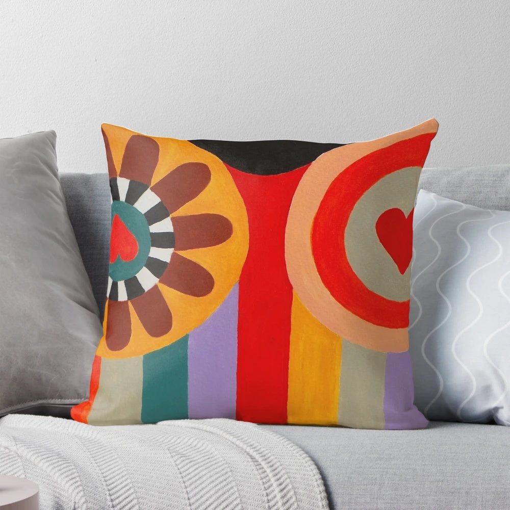 Vibrant Nana painting pillow in homage to French artist Niki de Saint Phalle, featuring colorful stripes and a playful female figure.