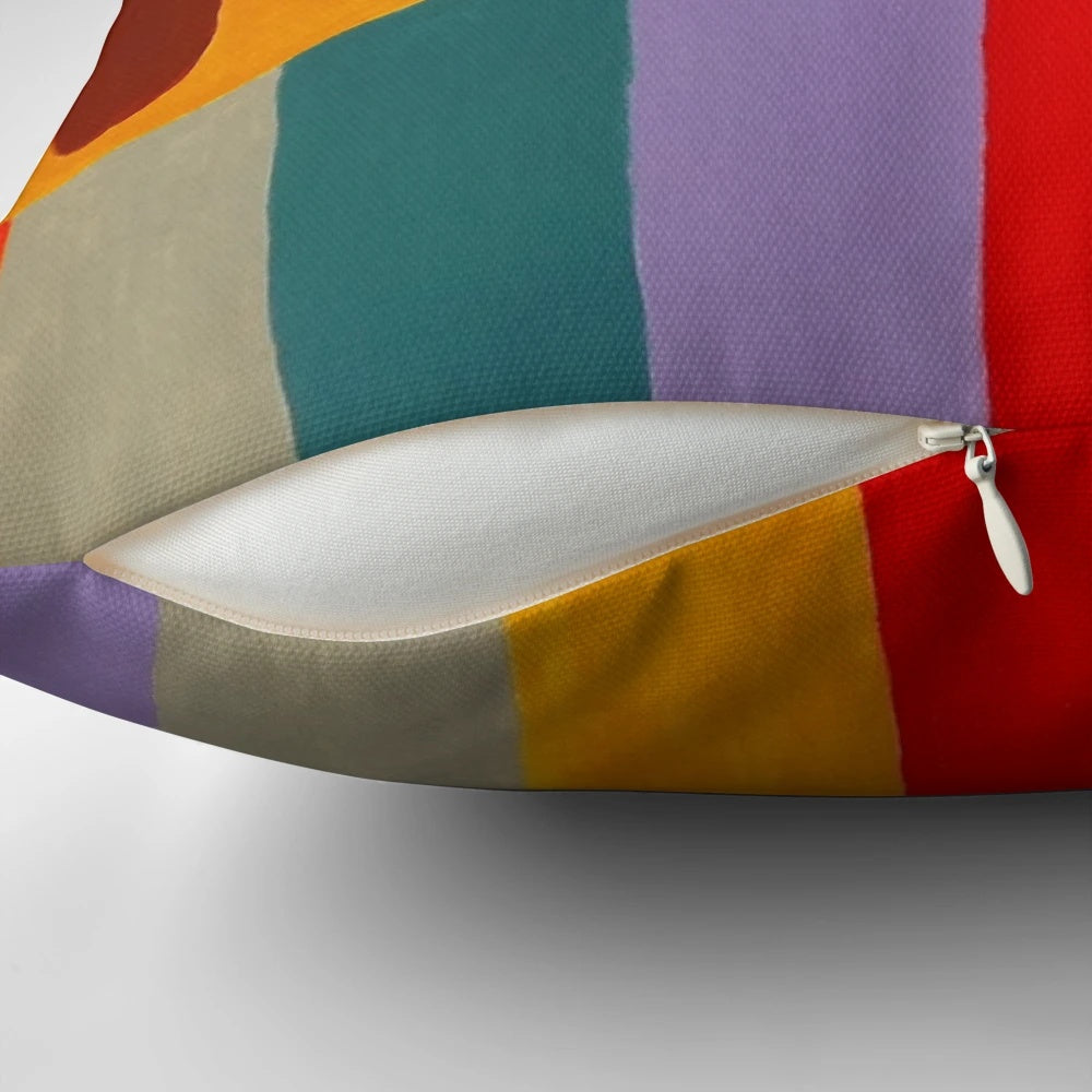 Vibrant Nana painting pillow in homage to French artist Niki de Saint Phalle, featuring colorful stripes and a playful female figure.