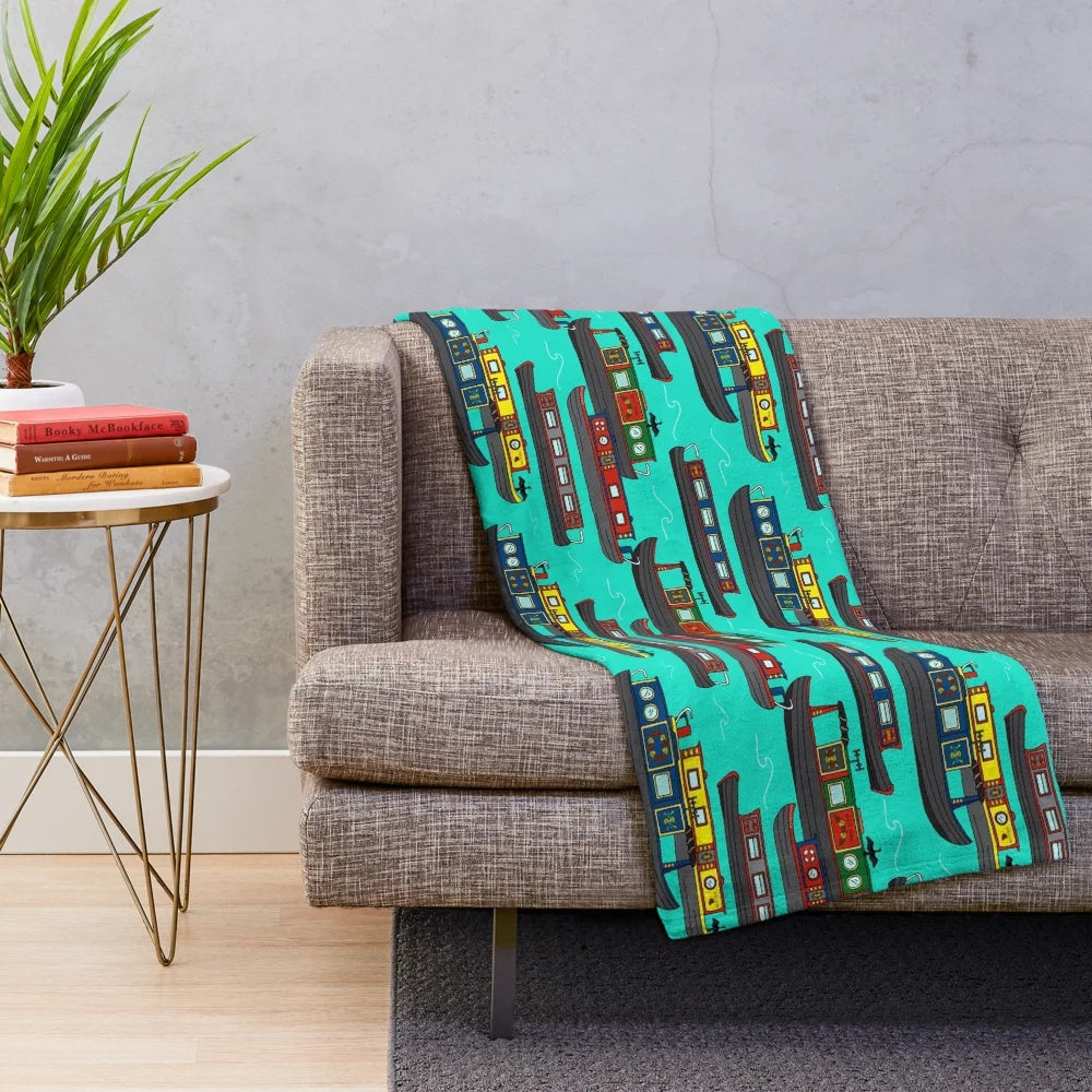 Plush blanket featuring a colorful scene of canal boats and barges on a European waterway