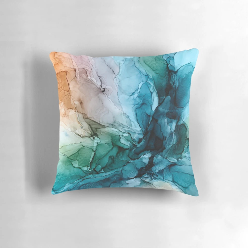 Vibrant abstract painting in shades of blue and orange on a decorative throw pillow, perfect for ocean-themed home decor.