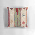 Vibrant bohemian-style accent pillow with an abstract, nature-inspired print in a retro, vintage-inspired design.