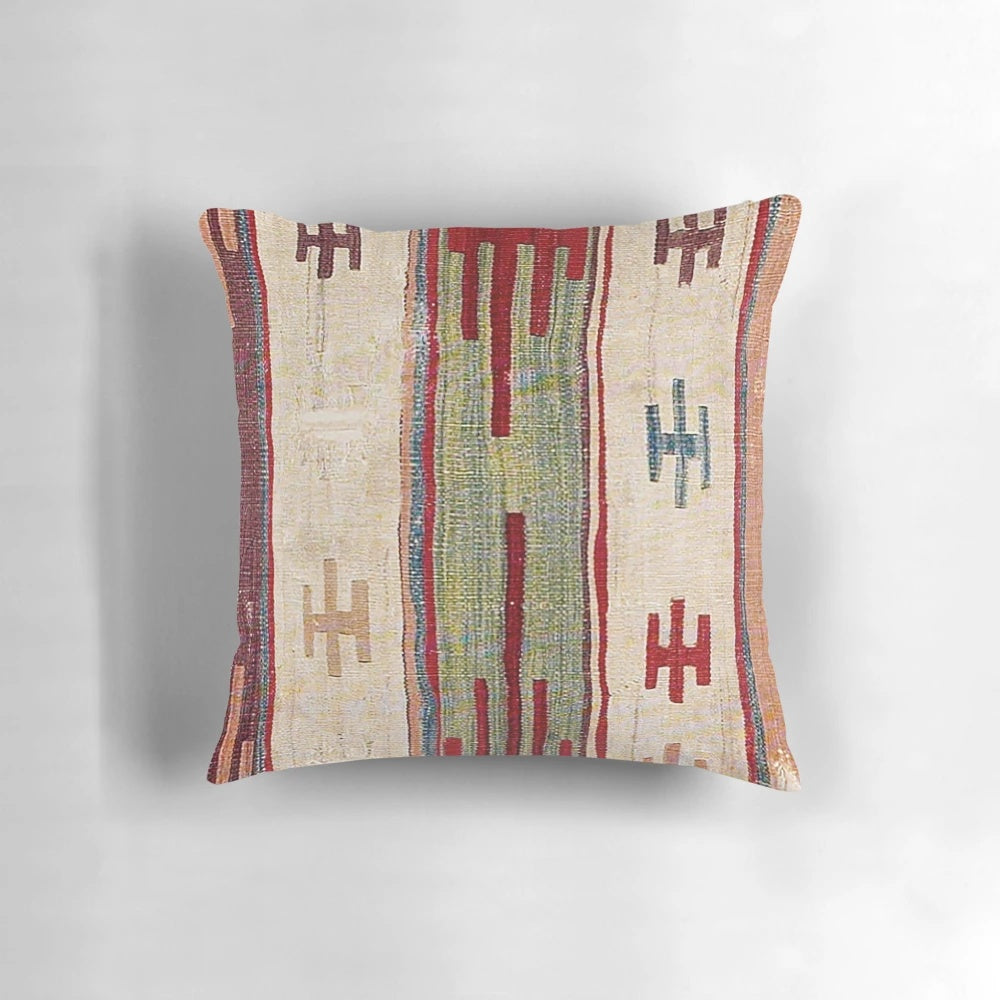 Vibrant bohemian-style accent pillow with an abstract, nature-inspired print in a retro, vintage-inspired design.