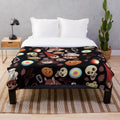 Colorful plush blanket featuring the characters and patterns from the animated show Over the Garden Wall