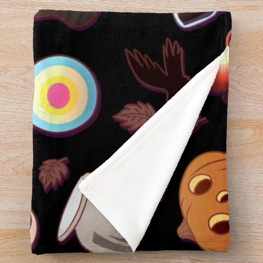 Colorful plush blanket featuring the characters and patterns from the animated show Over the Garden Wall