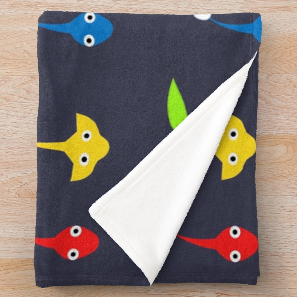 Vibrant Pikmin characters plush blanket featuring red, blue, and yellow Pikmin