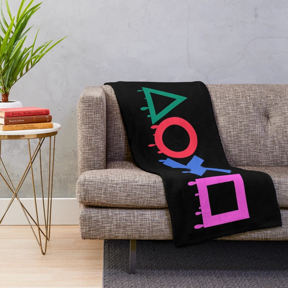 Playstation-themed plush blanket with gaming symbols and controller