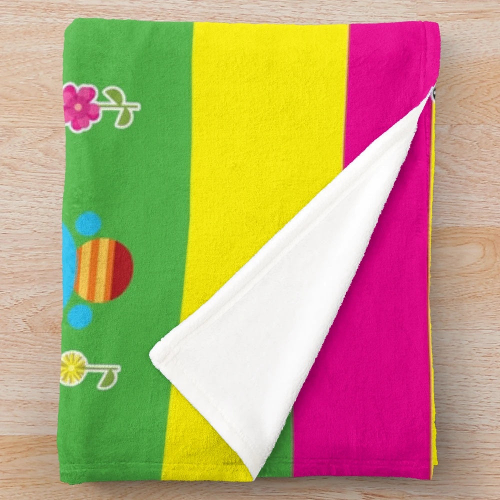 Colorful plush blanket featuring characters from Charlie's Colorforms City