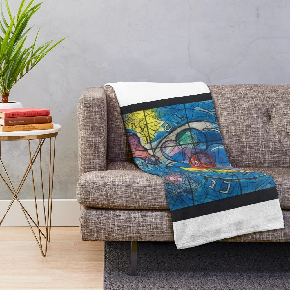 Plush blanket featuring a colorful design inspired by Marc Chagall's famous Jerusalem Windows artwork