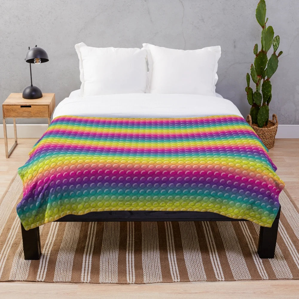Colorful plush blanket with pop it toy design