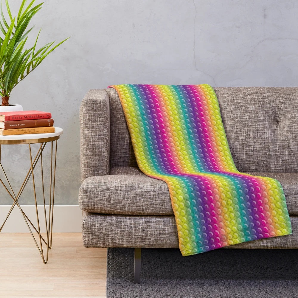 Colorful plush blanket with pop it toy design