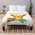 A plush blanket featuring a whimsical, colorful illustration of a shocked giraffe eating leaves
