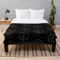 Colorful plush blanket featuring a peace sign design with legendary animals for wildlife conservation