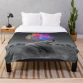 Vibrant plush blanket featuring a surreal rainbow elephant design