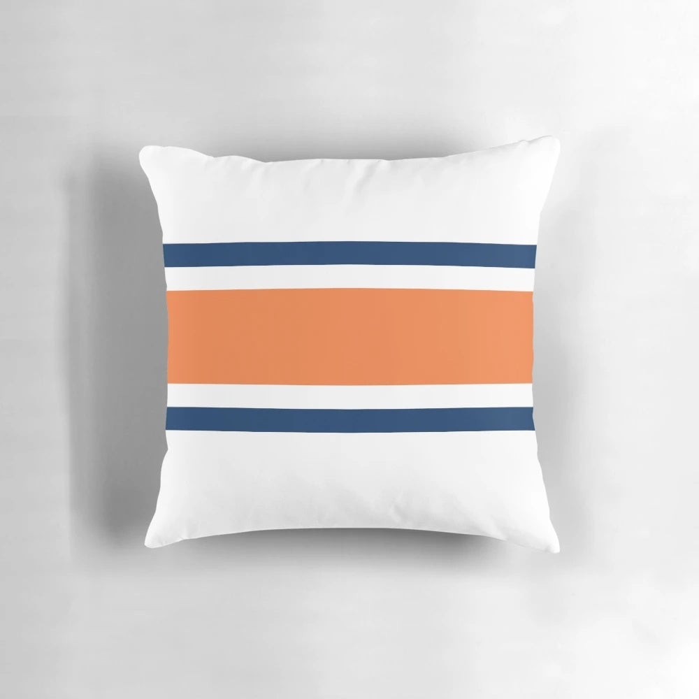 Colorful power stripe pattern pillow in orange, navy, and white colors