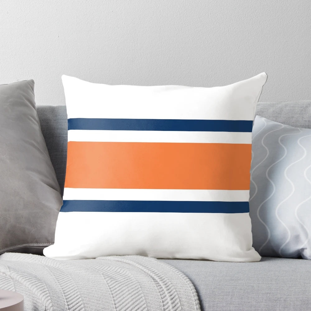 Colorful power stripe pattern pillow in orange, navy, and white colors