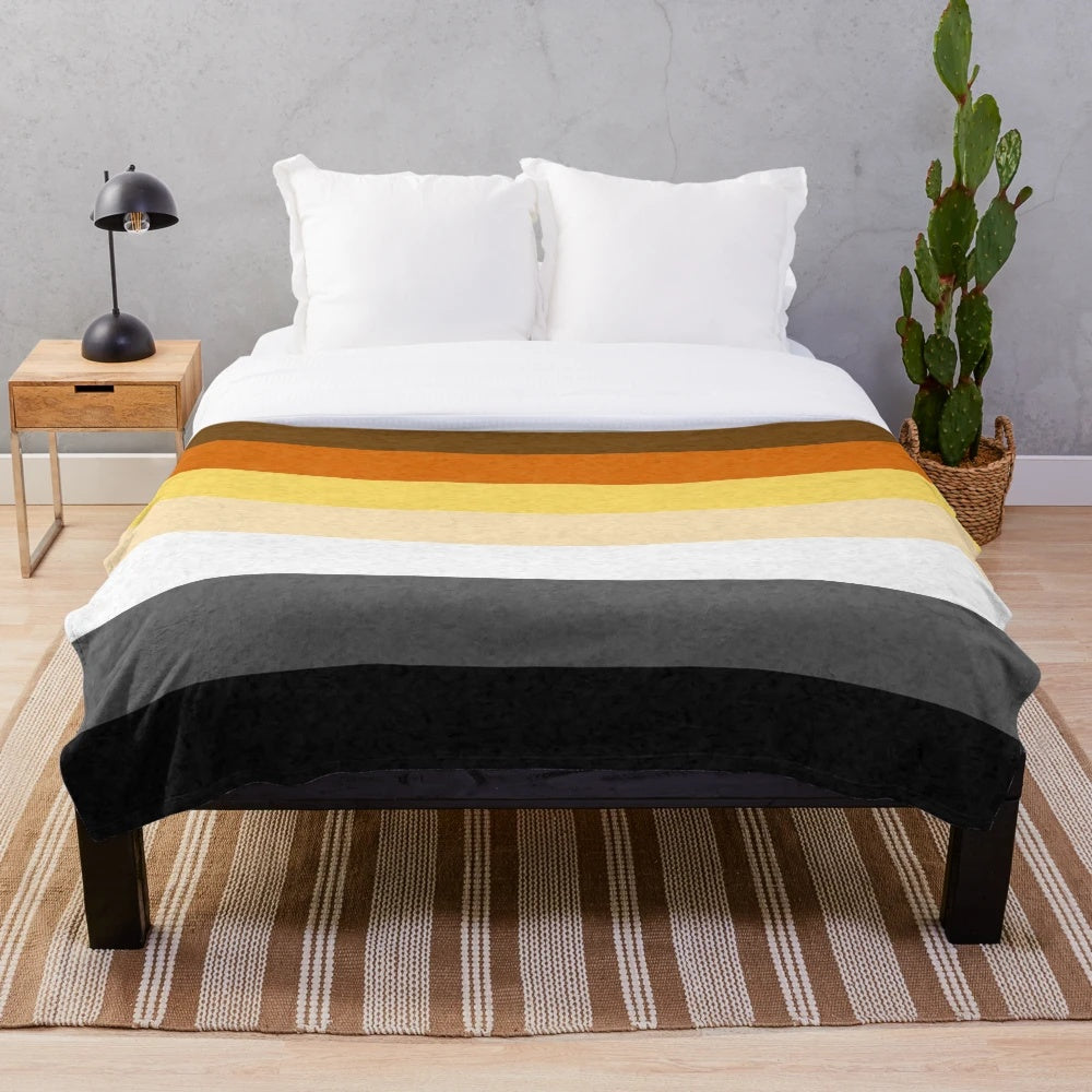 Soft and cozy plush blanket featuring a gay bear design against a pride flag background