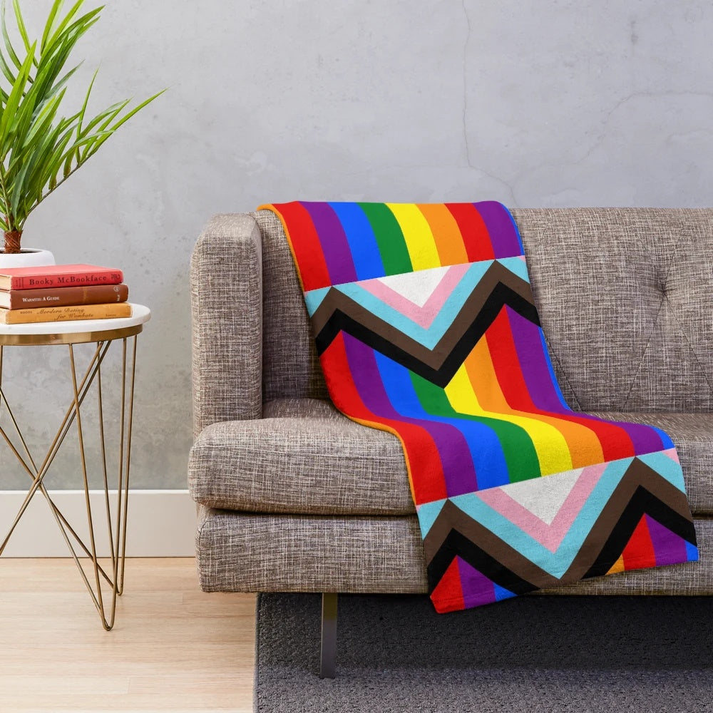 Colorful progress pride flag plush blanket with stripes of the LGBTQ+ pride flag